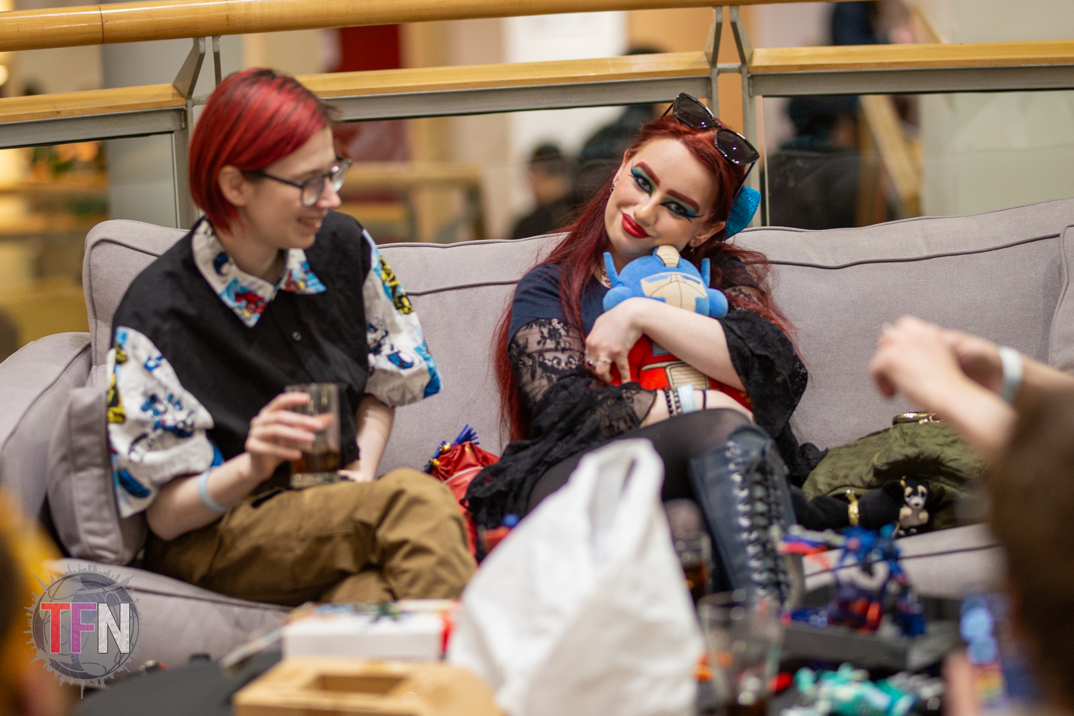 Attendees relaxing with an Optimus Prime Plushie at our last Manchester event